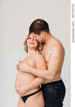a passionate man and pregnan woman topless in black underwear a passionate man and pregnan woman topless in black underwear 99720792