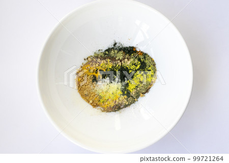 Tablet with multicolored powders of spirulina, curcus, Q10 supplements, etc. 99721264