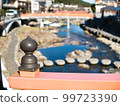 A river flowing through Yumoto Onsen, a bridge and an ornament 99723390