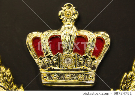Awards ceremony shield with a golden crown design Awards ceremony shield with a golden crown design 99724791