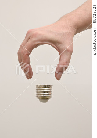 Man Hand Shaped like A Light Bulb Man Hand Shaped like A Light Bulb 99725323