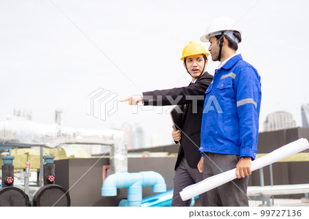 Professional Asian foreman and construction manager talking - discussing about building structure plant together. Businessman and construction engineer having a discussion. Professional Asian foreman and construction manager talking - discussing about building structure plant together. Businessman and construction engineer having a discussion. 99727136