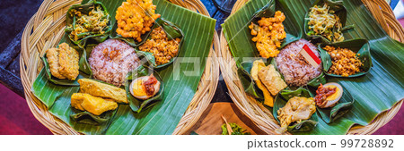 Nasi lemak, Nasi campur, Indonesian Balinese rice with potato fritter, sate lilit, fried tofu, spicy boiled eggs, and peanut BANNER, LONG FORMAT 99728892