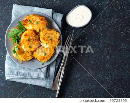 Potatoes pancakes latkes, flapjacks, hash brown 99728893