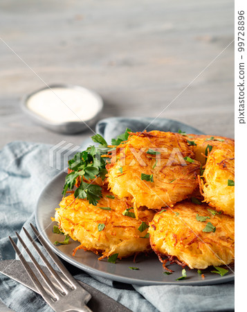 Potatoes pancakes latkes, flapjacks, hash brown 99728896