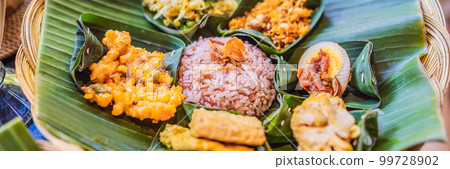 Nasi lemak, Nasi campur, Indonesian Balinese rice with potato fritter, sate lilit, fried tofu, spicy boiled eggs, and peanut BANNER, LONG FORMAT 99728902
