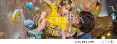 Dad and son at the climbing wall. Family sport, healthy lifestyle, happy family BANNER, LONG FORMAT 99728919