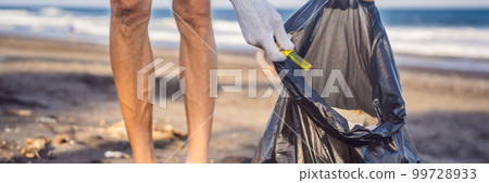 Young man cleaning up the beach. Natural education of children BANNER, LONG FORMAT 99728933