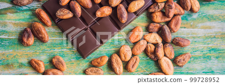 Chocolate and cocoa beans on color wooden background BANNER, LONG FORMAT 99728952