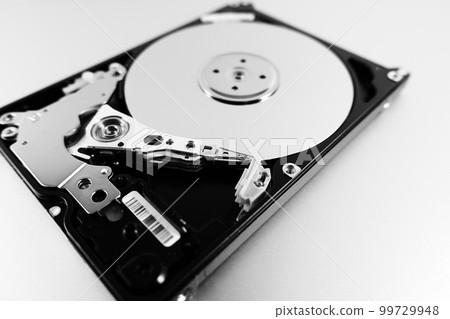Computer hard drive with top cover removed. Disassembled HDD of a personal computer. Selective Focus 99729948
