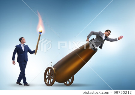 Concept of lay-off with businessman and cannon 99730212