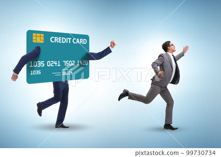Businessman in the credit card debt concept Businessman in the credit card debt concept 99730734