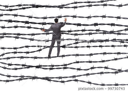Businessman in barbed wire concept 99730743