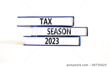Tax season 2023 symbol. Concept words Tax season 2023 on books on a beautiful white table white background. Business Tax season 2023 concept. Copy space. 99730929