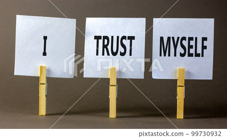 I trust myself symbol. Concept words I trust myself on white papers on wooden clothespins. Beautiful grey table grey background. Business, psychological and I trust myself concept. Copy space. I trust myself symbol. Concept words I trust myself on white papers on wooden clothespins. Beautiful grey table grey background. Business, psychological and I trust myself concept. Copy space. 99730932