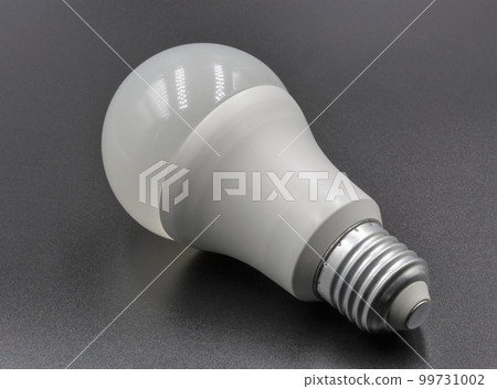 White energy saving light LED bulb closeup on black 99731002