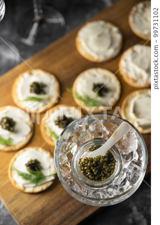 caviar on cracker with cream cheese caviar on cracker with cream cheese 99731102