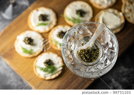 caviar on cracker with cream cheese caviar on cracker with cream cheese 99731103