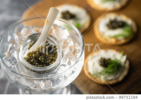 caviar on cracker with cream cheese caviar on cracker with cream cheese 99731104