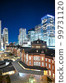 Red bricks and skyscrapers at Tokyo Station at night 99731120