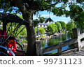 Rickshaw through the stone bridge and old townscape 99731123