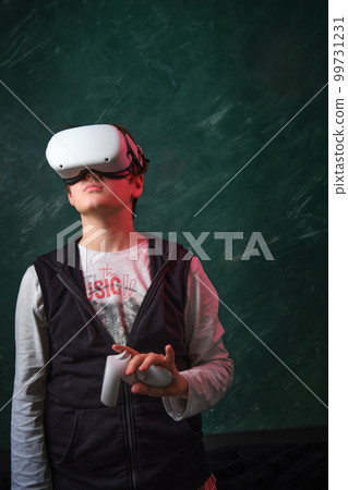 a boy playing with VR glasses a boy playing with VR glasses 99731231