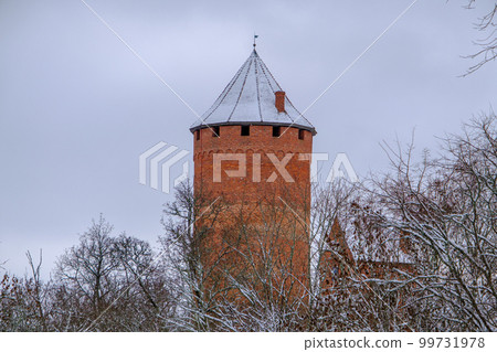 Medieval Turaida Castle complex in winter. Red brick buildings. in the Vidzeme region of Latvia. Gaujas national park. 99731978