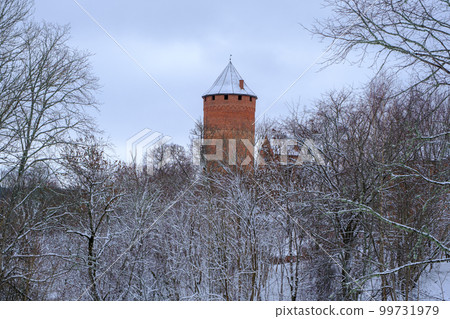 Medieval Turaida Castle complex in winter. Red brick buildings. in the Vidzeme region of Latvia. Gaujas national park. 99731979