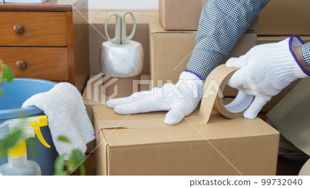 Image of packing for moving and decluttering 99732040