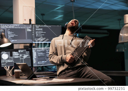 Database programmer playing guitar with keyboard, writing code with cloud computing and programming html source. Cheerful smiling developer having fun and acting silly in office. Database programmer playing guitar with keyboard, writing code with cloud computing and programming html source. Cheerful smiling developer having fun and acting silly in office. 99732231
