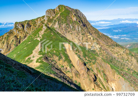 Climbing Mt. Yatsugatake in Nagano Prefecture: Mt. Amida seen from the Bunzaburo trail to the summit of Mt. Akadake Climbing Mt. Yatsugatake in Nagano Prefecture: Mt. Amida seen from the Bunzaburo trail to the summit of Mt. Akadake 99732709