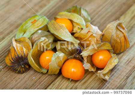 Physalis peruviana yellow, edible physalis species. Vegetarian dish 99737098