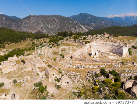 Drone view of ruins of Roman amphitheater at Rhodiapolis, Kumluca, Turkey 99737377