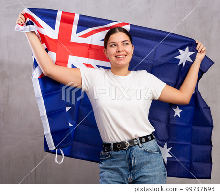 Happy girl stands with flag of Australia .Isolated Happy girl stands with flag of Australia .Isolated 99737693