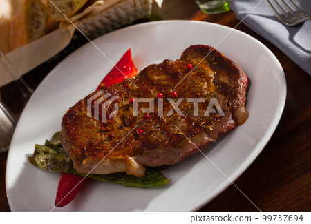 Beef steak with braised vegetables Beef steak with braised vegetables 99737694