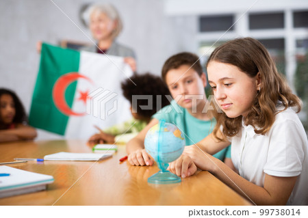 students listen to woman teacher who talks about Algeria students listen to woman teacher who talks about Algeria 99738014
