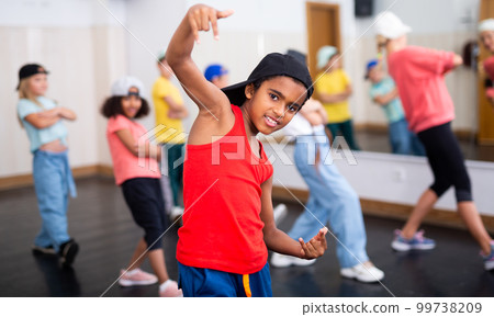 Afro boy hip hop dancer exercising at class Afro boy hip hop dancer exercising at class 99738209