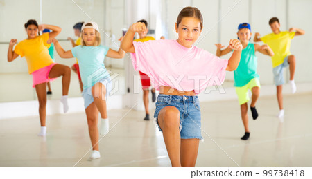 Tween girl krump dancer in choreographic studio with children 99738418