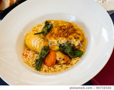 Traditional french cuisine, chicken thigh curry with rice 99738500