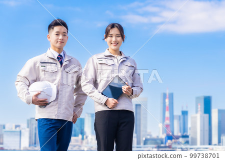 Engineers working at the development base under sunny weather 99738701