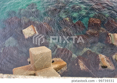 Wave breaking blocks near the jetty in Yaezuhama, Toyama City 99739331