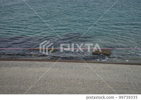 Wave breaking blocks near the jetty in Yaezuhama, Toyama City 99739335