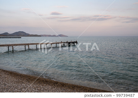 Wooden pier in sea at morning. Koktebel. Crimea Wooden pier in sea at morning. Koktebel. Crimea 99739487