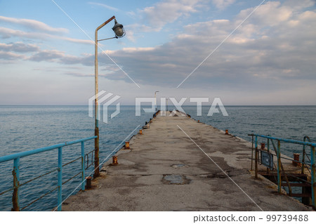 Old empty pier in blue sea. Koktebel. Crimea Old empty pier in blue sea. Koktebel. Crimea 99739488