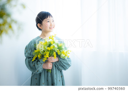 girl with a bouquet of mimosas girl with a bouquet of mimosas 99740360