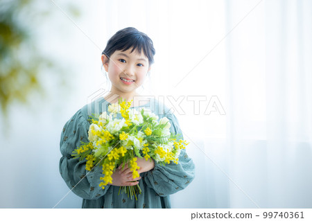 girl with a bouquet of mimosas girl with a bouquet of mimosas 99740361