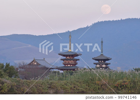 Twilight moonrise and scenery of Yakushiji Temple 99741146