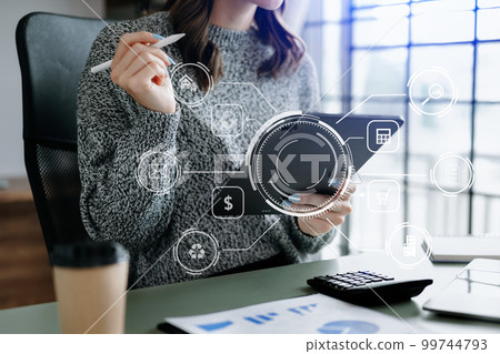 Digital marketing media in virtual screen.businesswoman hand working with mobile phone and modern compute with VR icon diagram at office in morning light Digital marketing media in virtual screen.businesswoman hand working with mobile phone and modern compute with VR icon diagram at office in morning light 99744793