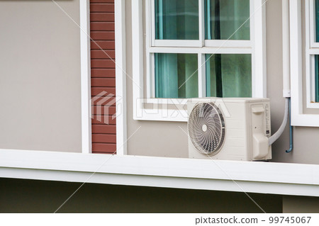 Air conditioner compressor outdoor unit installed outside the house Air conditioner compressor outdoor unit installed outside the house 99745067