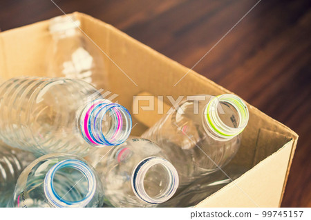 plastic bottles in recycling paper box reuse concept plastic bottles in recycling paper box reuse concept 99745157